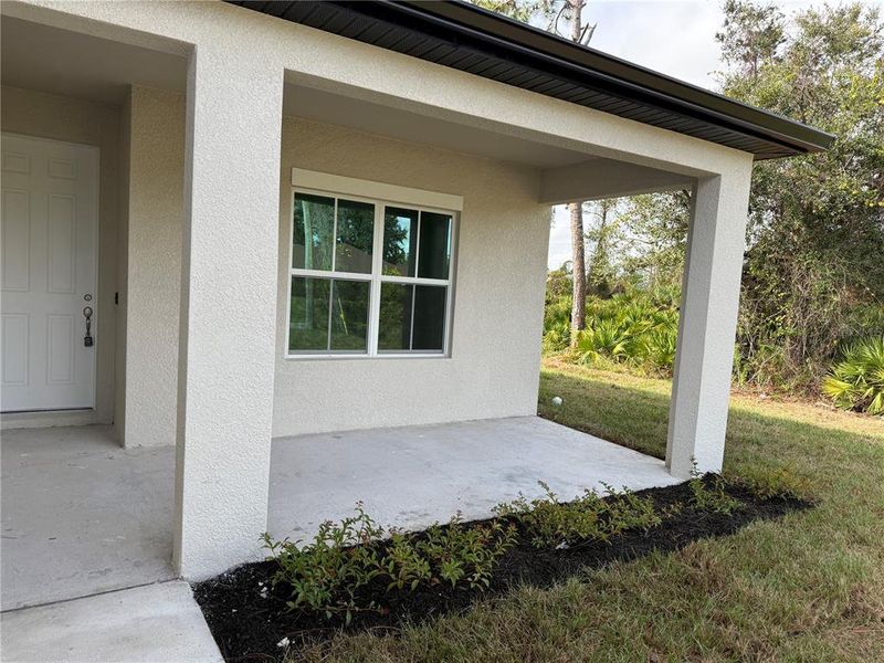Exterior details and patio area of a home in , North Port (Image 27).
