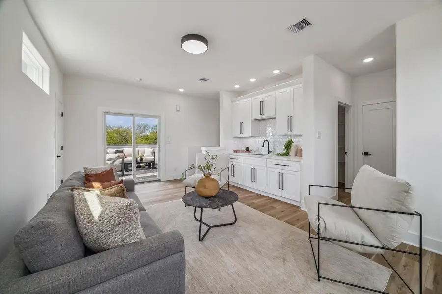 Third floor game room is ready for all your entertaining ideas. Equipped with a wet bar, tons of cabinet and closet space, a half bath and sliding doors into the large deck.