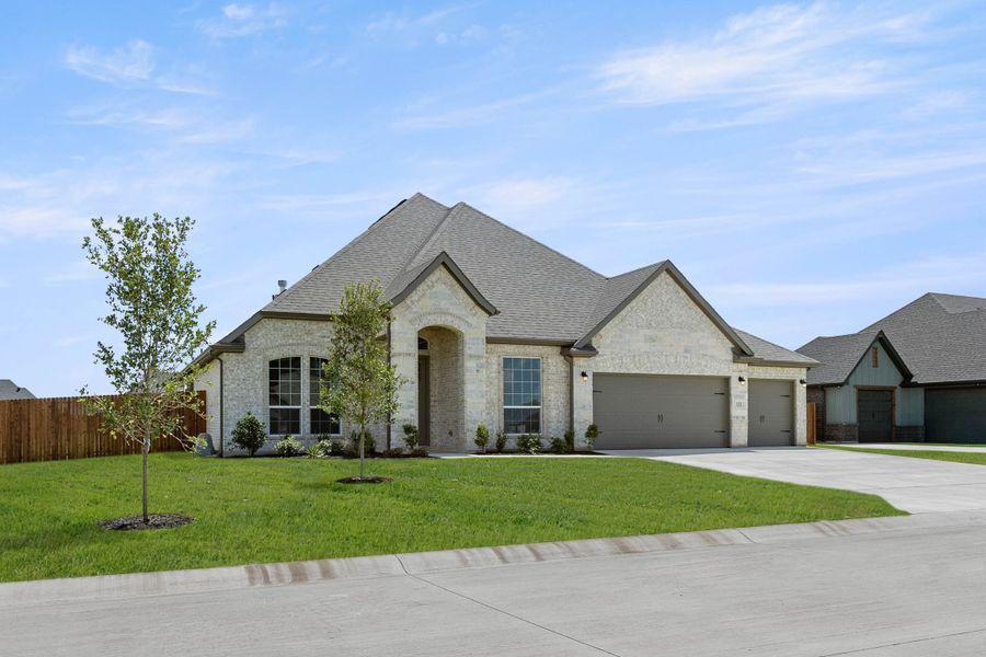 Front exterior of a new home in Coyote Crossing, Godley, TX, highlighting curb appeal (Image 2). Front exterior of a new home in Coyote Crossing, Godley, TX, highlighting curb appeal (Image 2).