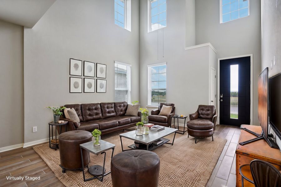 Virtually staged living room in the Medina floorplan at a Meritage Homes community.