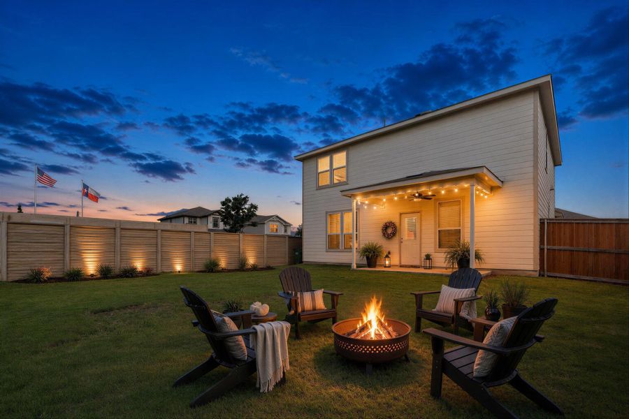 A well-maintained yard provides ample space for relaxation and entertaining, featuring a cozy fire pit. A well-maintained yard provides ample space for relaxation and entertaining, featuring a cozy fire pit.