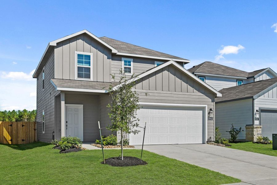 Front exterior of a new home in Northpark South, Porter, TX, highlighting curb appeal (Image 16). Front exterior of a new home in Northpark South, Porter, TX, highlighting curb appeal (Image 16).