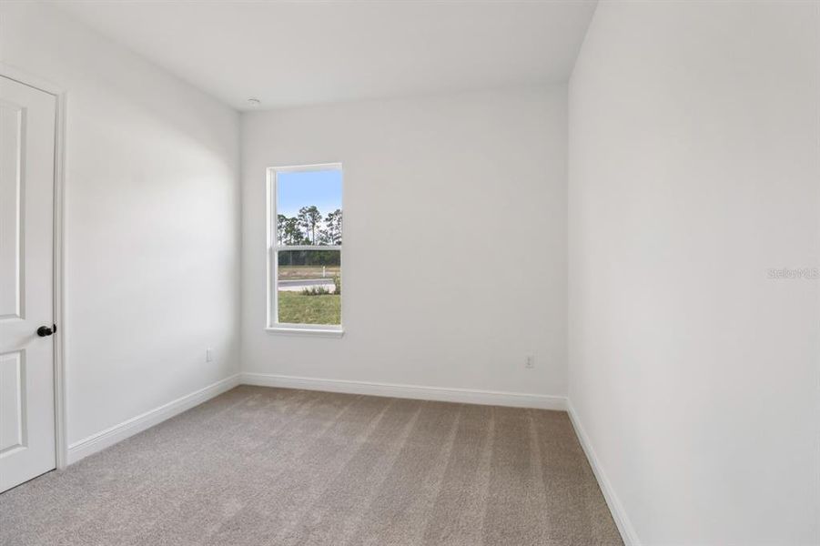 Spacious, unfurnished interior of a new home in Ardisia Park Estate, New Smyrna Beach (Image 7).