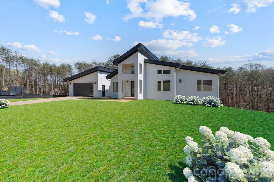 Front exterior of a new home in , Hickory, NC, highlighting curb appeal (Image 23).