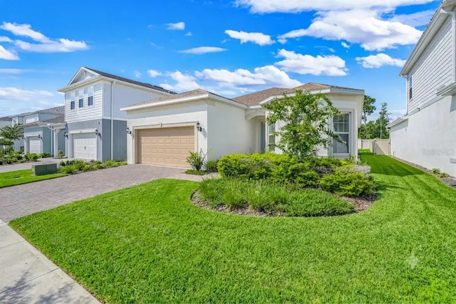 Front exterior of a new home in , Orlando, FL, highlighting curb appeal (Image 1). Front exterior of a new home in , Orlando, FL, highlighting curb appeal (Image 1).