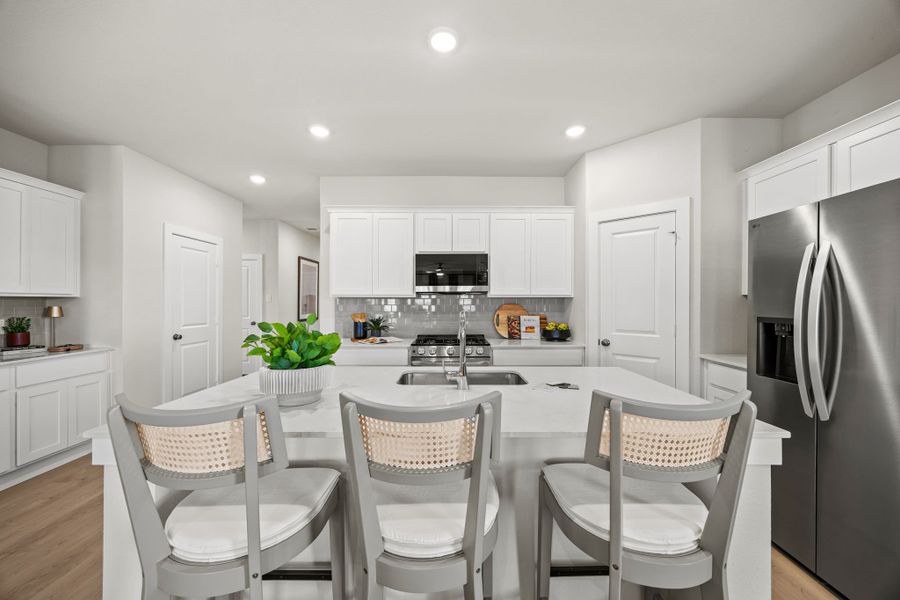 A kitchen with white cabinets. A kitchen with white cabinets.
