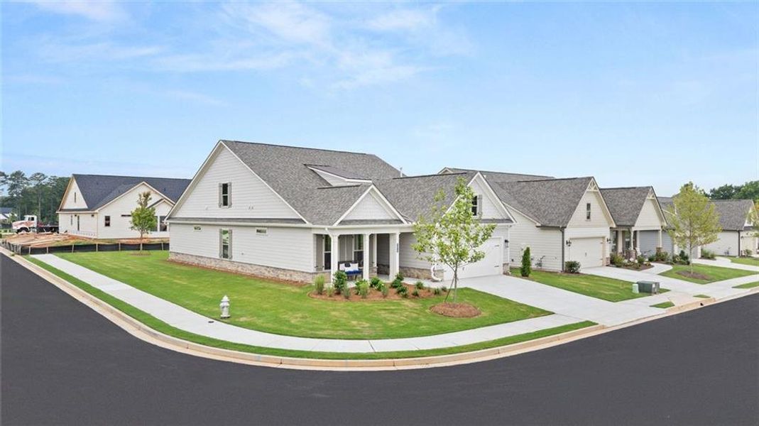 Front exterior of a new home in Soleil Summit Chase, Snellville, GA, highlighting curb appeal (Image 2). Front exterior of a new home in Soleil Summit Chase, Snellville, GA, highlighting curb appeal (Image 2).