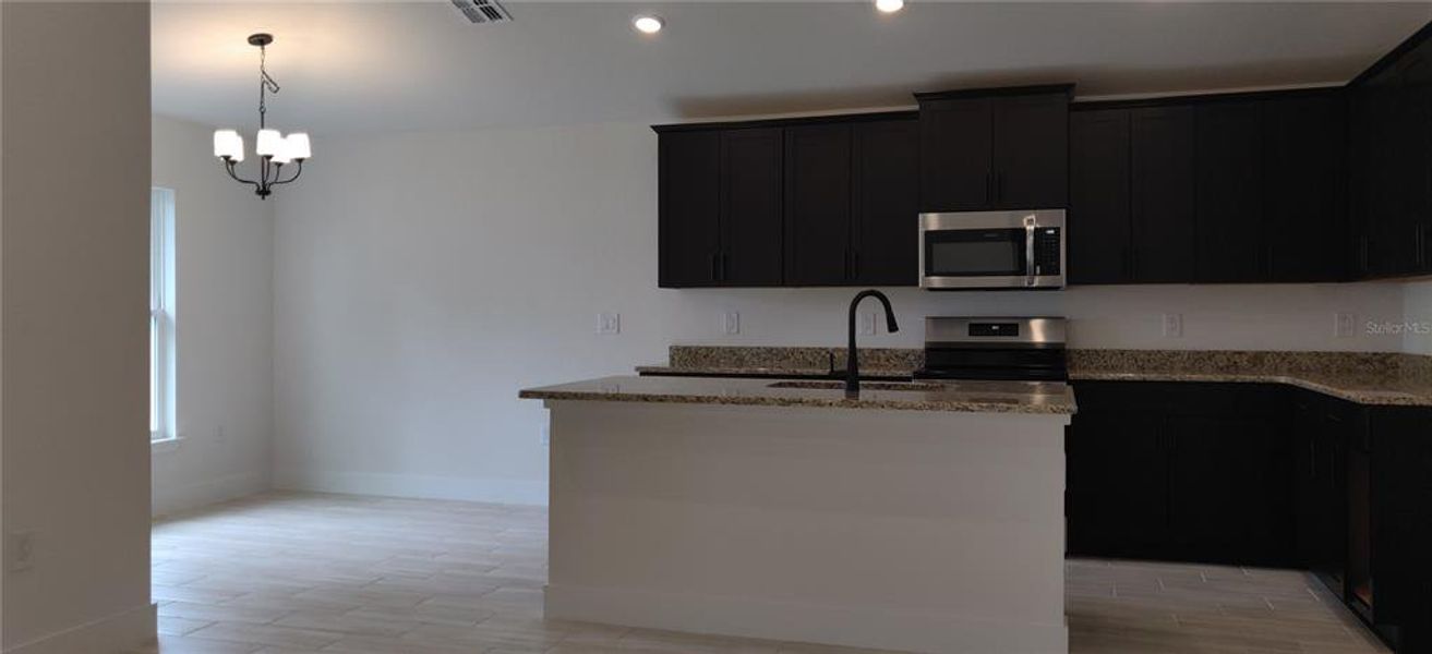 Furnished interior view inside a new home in Sunset Landing, Spring Hill (Image 4).