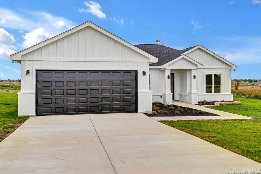 Front exterior of a new home in , La Vernia, TX, highlighting curb appeal (Image 28). Front exterior of a new home in , La Vernia, TX, highlighting curb appeal (Image 28).