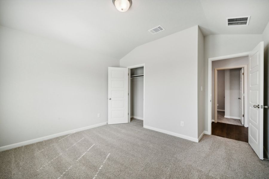 Guest bedroom in the Fitzhugh floorplan in a Meritage Homes community.