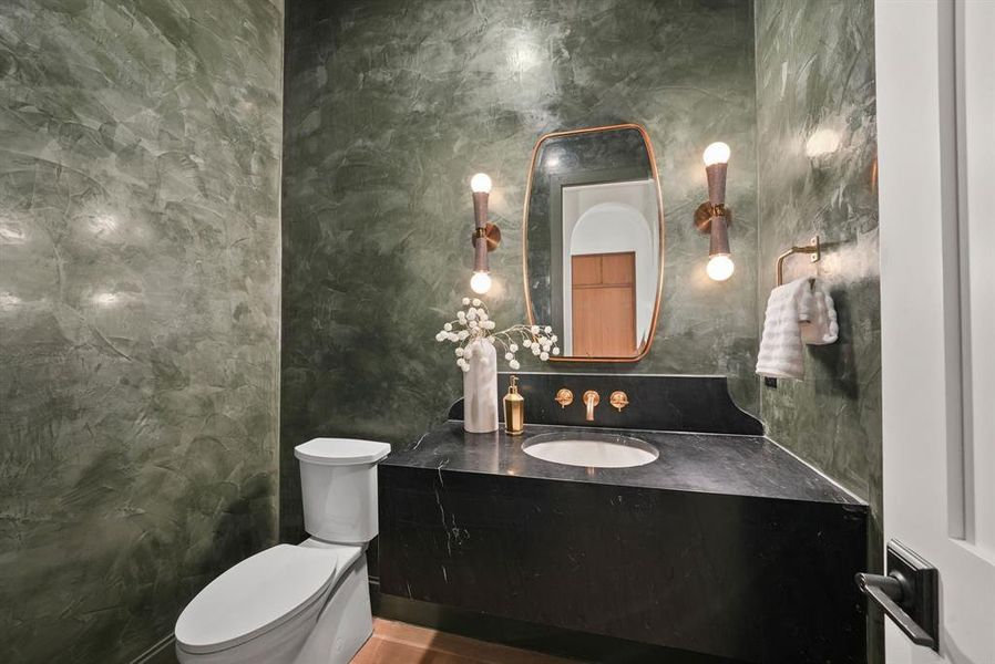 Half bathroom with vanity and tile walls Half bathroom with vanity and tile walls