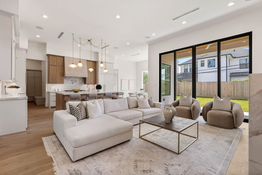 From this angle, the symmetry of the built-ins and the height of the ceilings are fully appreciated, enhanced by designer lighting and integrated linear air vents for a clean, streamlined look.