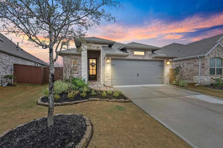 Front exterior of a new home in Meridiana 40'/45', Manvel, TX, highlighting curb appeal (Image 2). Front exterior of a new home in Meridiana 40'/45', Manvel, TX, highlighting curb appeal (Image 2).