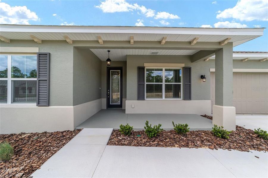 Exterior details and patio area of a home in On Top of the World Communities, Ocala (Image 4).