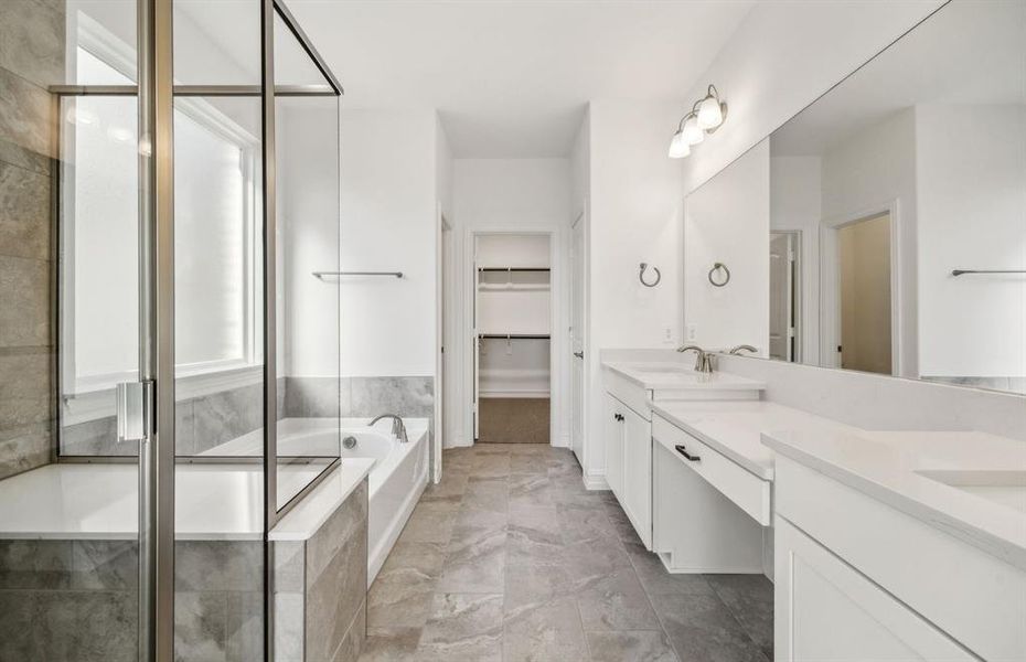 Owner's bathroom with dual vanity and oversized shower *real home pictured