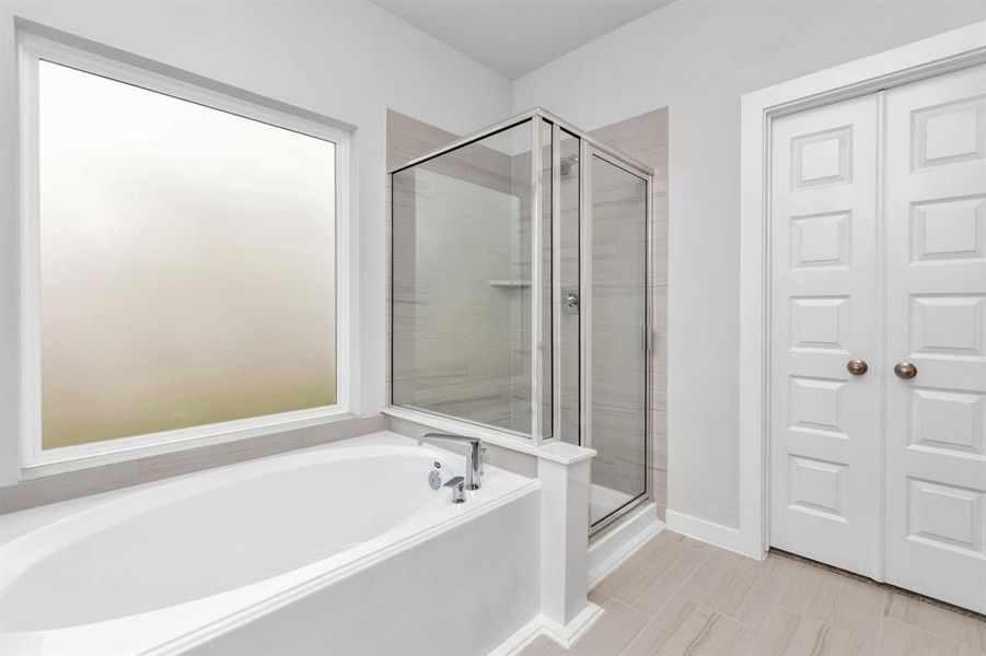 Another view of the primary bath. Sample photo of completed home with similar floor plan. As-built interior colors and selections may vary.