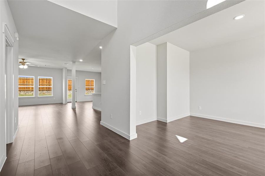 Unfurnished room with recessed lighting, dark wood-style floors, and a ceiling fan Unfurnished room with recessed lighting, dark wood-style floors, and a ceiling fan