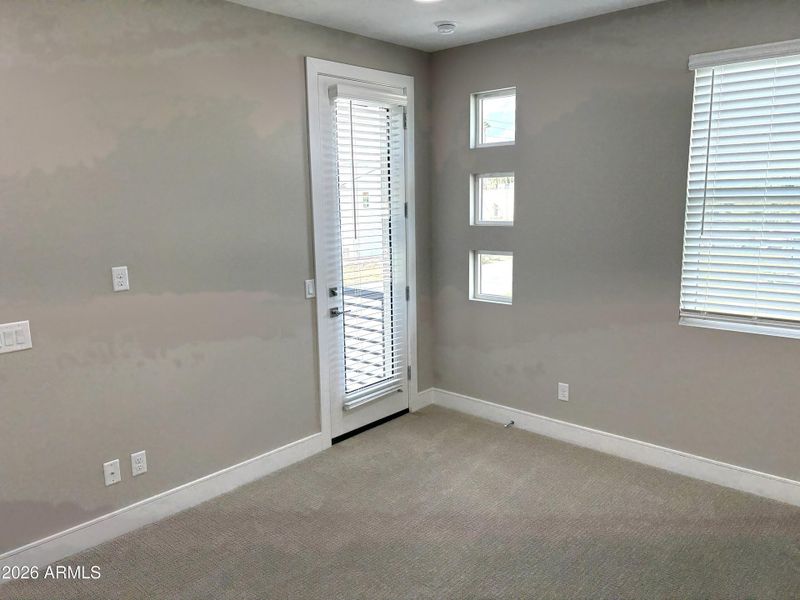 Primary Bedroom with balcony access