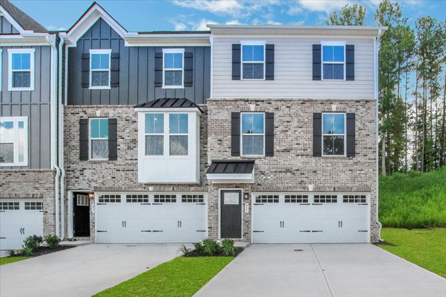 Front exterior of a new home in Park Ridge at Sugar Hill, Sugar Hill, GA, highlighting curb appeal (Image 1). Front exterior of a new home in Park Ridge at Sugar Hill, Sugar Hill, GA, highlighting curb appeal (Image 1).