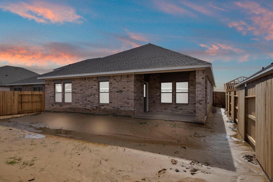 Exterior details and patio area of a home in Windrose Green 50', Angleton (Image 23).