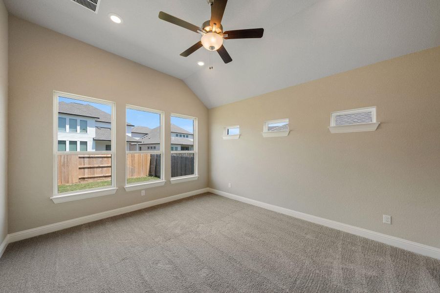 Unfurnished room featuring carpet flooring, lofted ceiling, a ceiling fan, and recessed lighting