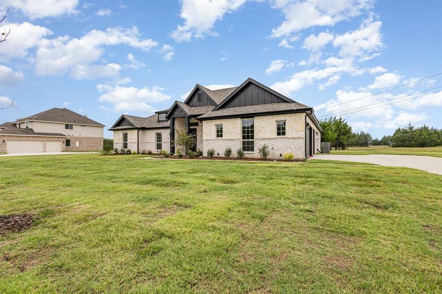 Front exterior of a new home in Sagebrush Addition, Midlothian, TX, highlighting curb appeal (Image 23).