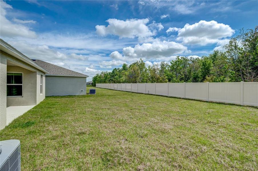 Exterior details and patio area of a home in Crosswind Point, Parrish (Image 18).