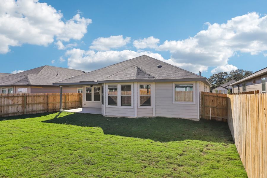 Back exterior of the Oleander floorplan at a Meritage Homes community. Back exterior of the Oleander floorplan at a Meritage Homes community.