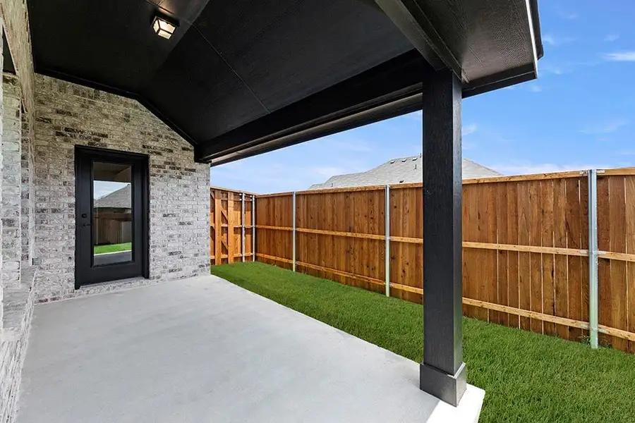Exterior details and patio area of a home in Walden Pond, Forney (Image 3).