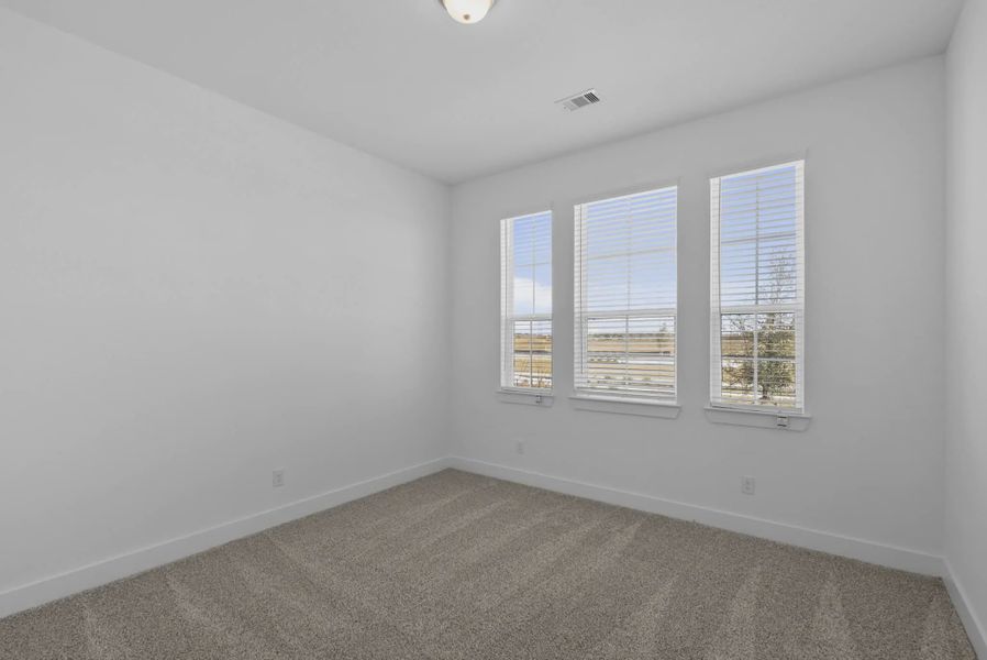 Representative unfurnished interior of a home built from the Nicklaus by Chesmar Homes in Riceland Alley Loads, Mont Belvieu (Image 70).