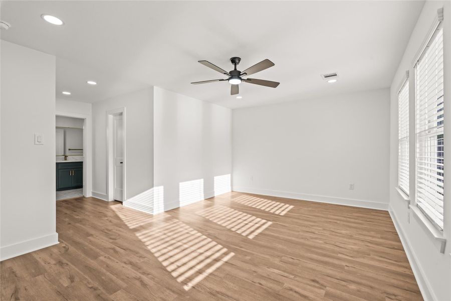 Space to breathe. The vast footprint of the main bedroom gives you plenty of extra space for a cozy reading nook or a morning yoga corner.