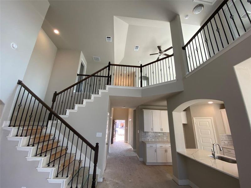 Look at this impressive staircase with wrought iron spindles!