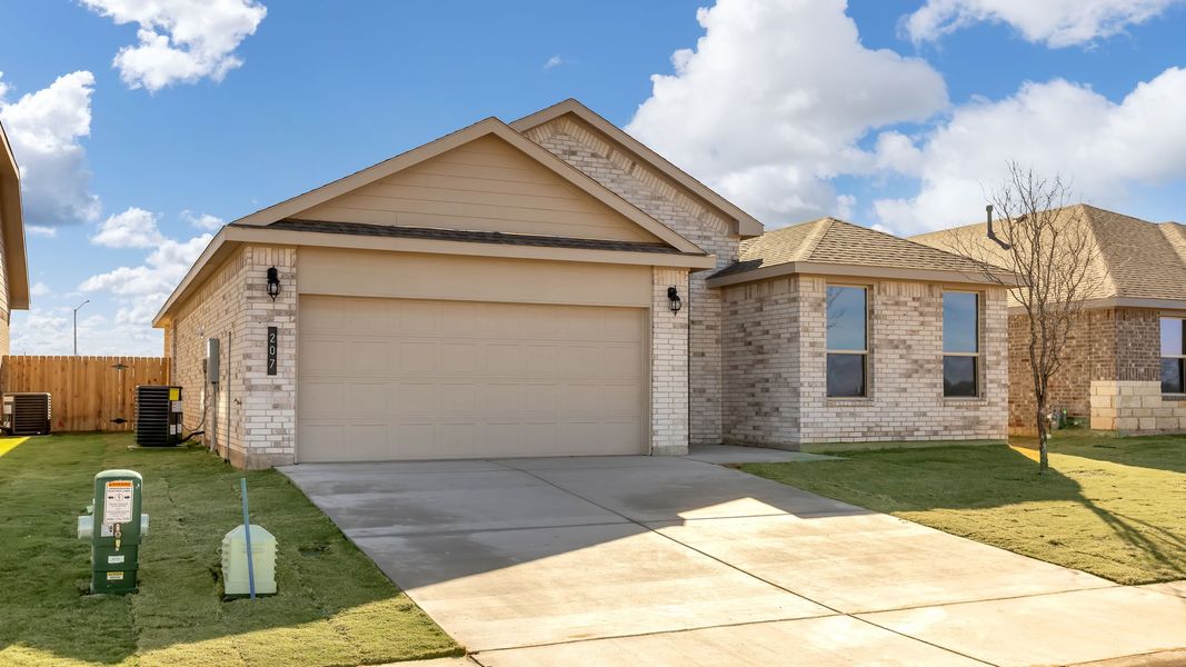 Front exterior of a new home in Overlook West, Wolfforth, TX, highlighting curb appeal (Image 15). Front exterior of a new home in Overlook West, Wolfforth, TX, highlighting curb appeal (Image 15).