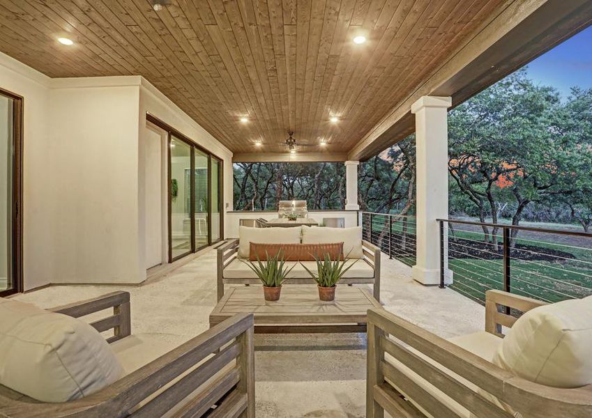 Staged covered back patio at dusk.