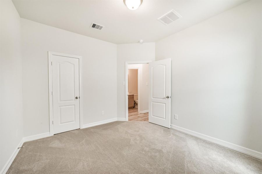 A closet adds extra storage, and this bedroom offers easy access to the secondary bathroom just steps away. A closet adds extra storage, and this bedroom offers easy access to the secondary bathroom just steps away.