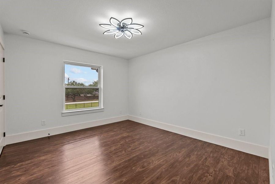 One of four additional bedrooms as you enter the upstairs floor