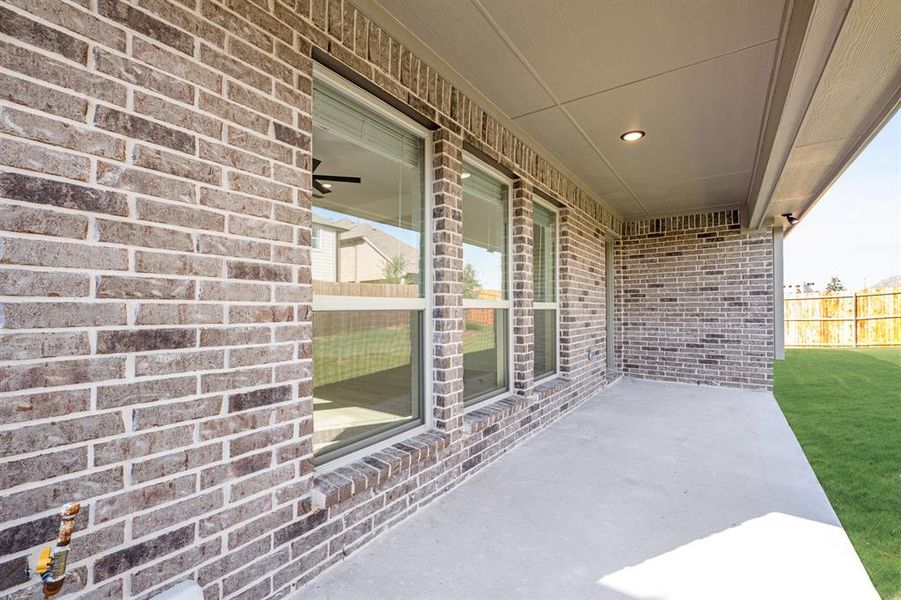 Exterior details and patio area of a home in West Crossing, Anna (Image 3). Exterior details and patio area of a home in West Crossing, Anna (Image 3).