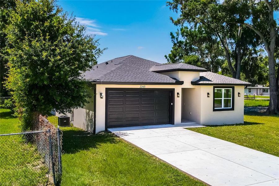 Front exterior of a new home in , Plant City, FL, highlighting curb appeal (Image 25). Front exterior of a new home in , Plant City, FL, highlighting curb appeal (Image 25).
