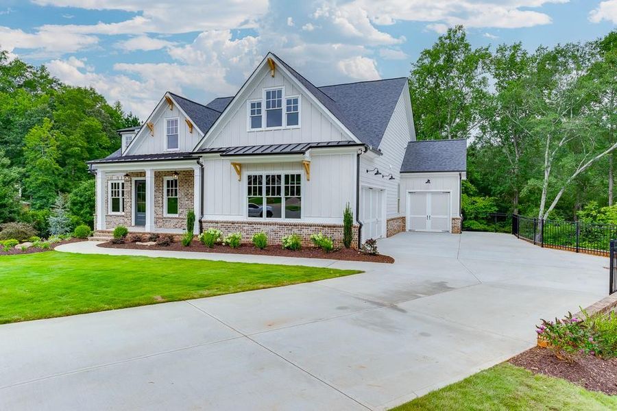 Front exterior of a new home in , Cumming, GA, highlighting curb appeal (Image 28).