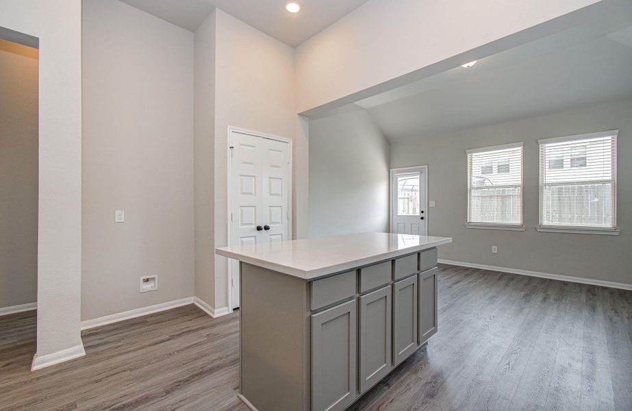 Kitchen has a large functional island with additional cabinetry storage underneath