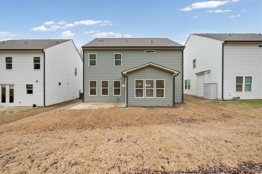 Exterior details and patio area of a home in Enclave at Edgewater, Holly Springs (Image 31).
