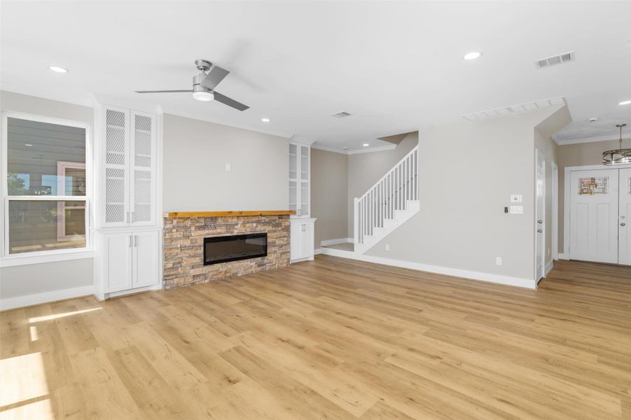 Living room features recessed lighting, updated fan, built in shelving and fresh paint Living room features recessed lighting, updated fan, built in shelving and fresh paint