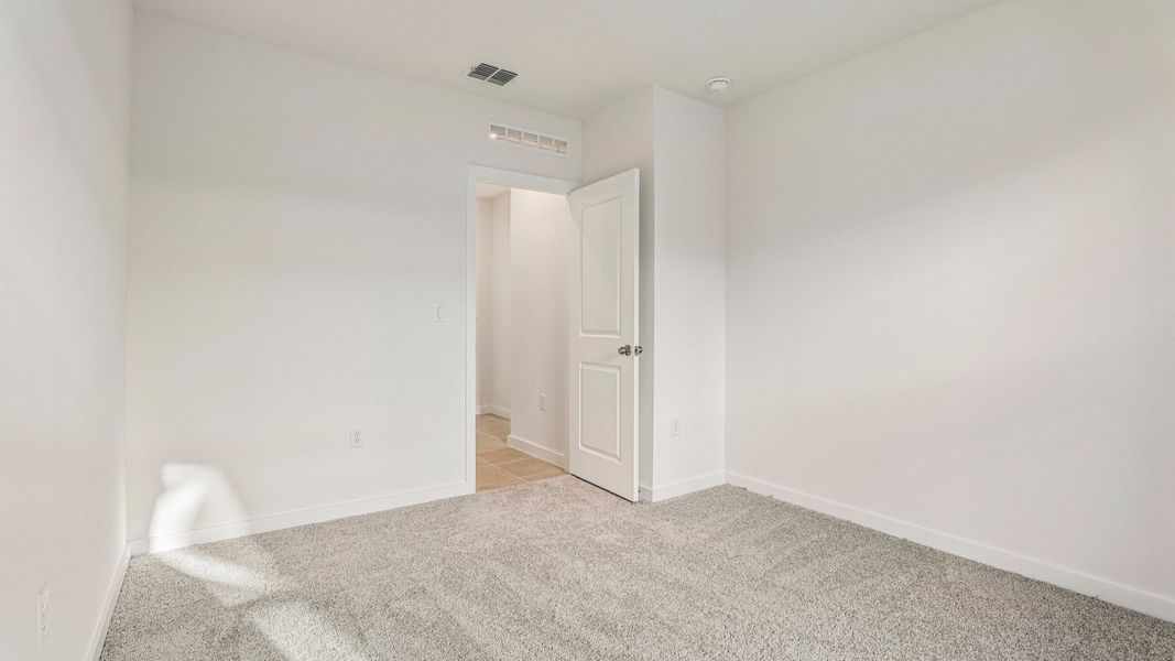 Furnished interior view inside a new home in Cyrene at Harmony, St. Cloud (Image 30).