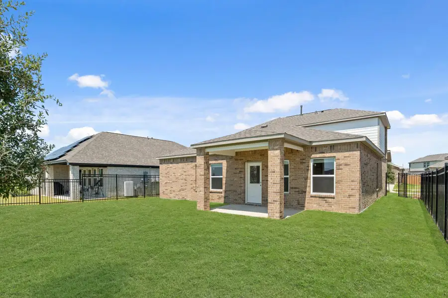 Front exterior of a new home in Sunterra, Katy, TX, highlighting curb appeal (Image 12). Front exterior of a new home in Sunterra, Katy, TX, highlighting curb appeal (Image 12).