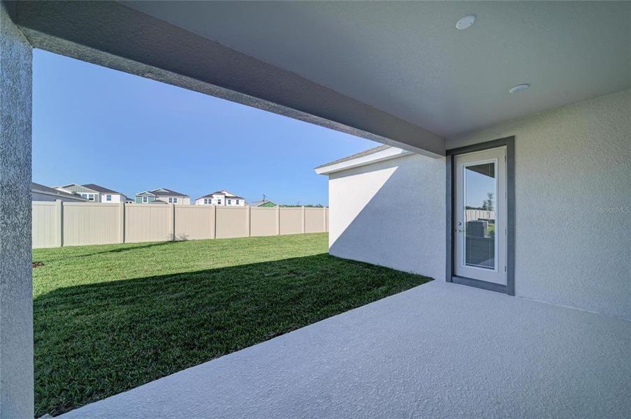 Exterior details and patio area of a home in Pasadena Woods, Wesley Chapel (Image 2).