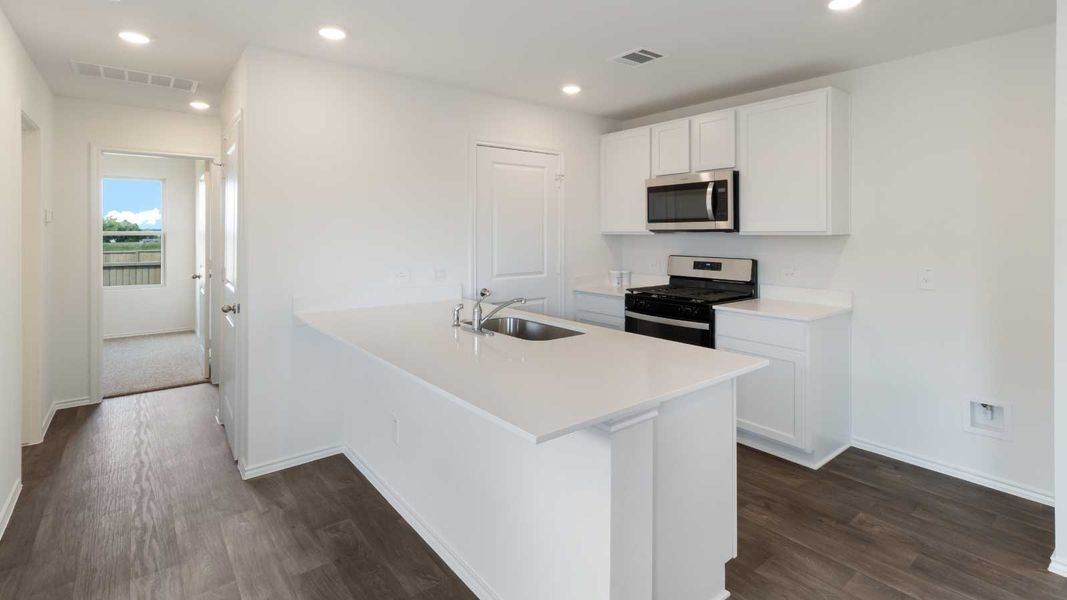 Representative furnished interior of a home built from the The Dahlia by D.R. Horton in Marigold, Kyle (Image 4).