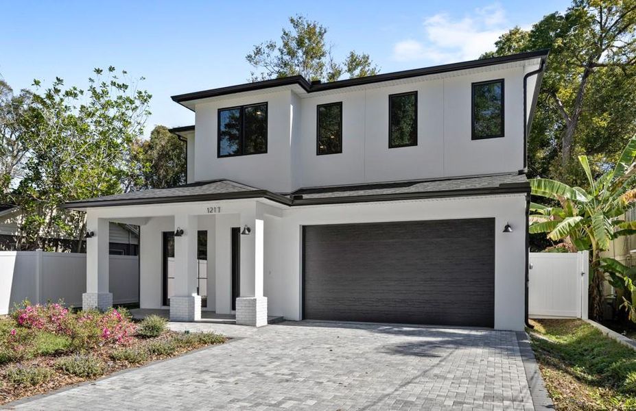 Front exterior of a new home in , Orlando, FL, highlighting curb appeal (Image 33).