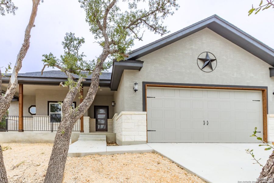 Front exterior of a new home in , Fischer, TX, highlighting curb appeal (Image 1). Front exterior of a new home in , Fischer, TX, highlighting curb appeal (Image 1).