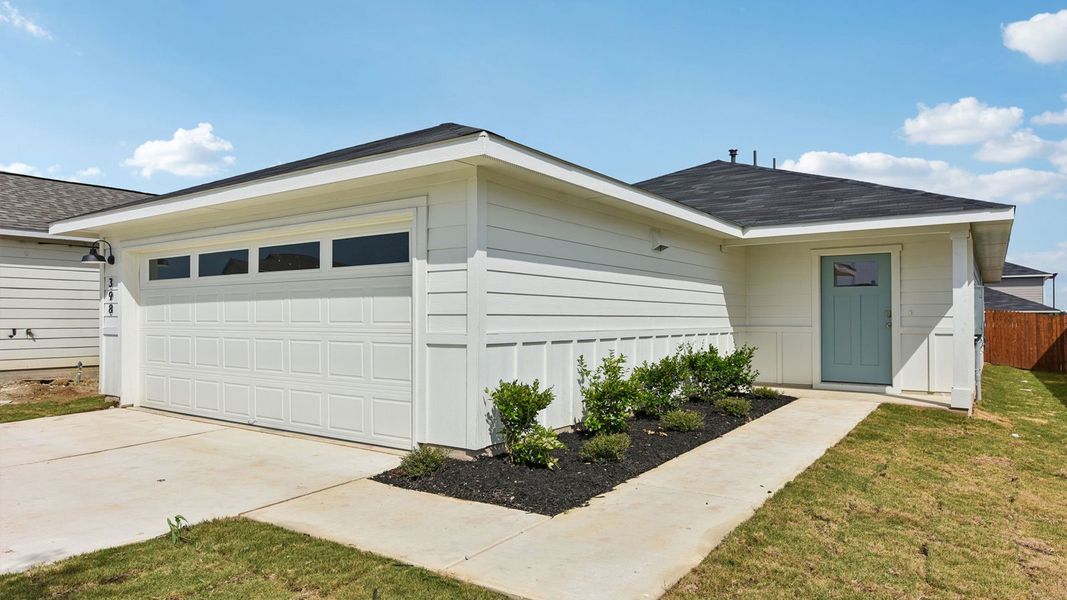 Front exterior of a new home in Watermill, Uhland, TX, highlighting curb appeal (Image 21). Front exterior of a new home in Watermill, Uhland, TX, highlighting curb appeal (Image 21).