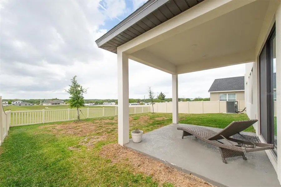 Exterior details and patio area of a home in Hilltop Point, Dade City (Image 3).